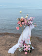Ocean wedding, broken arch, bright pastel floral decor, golden stands