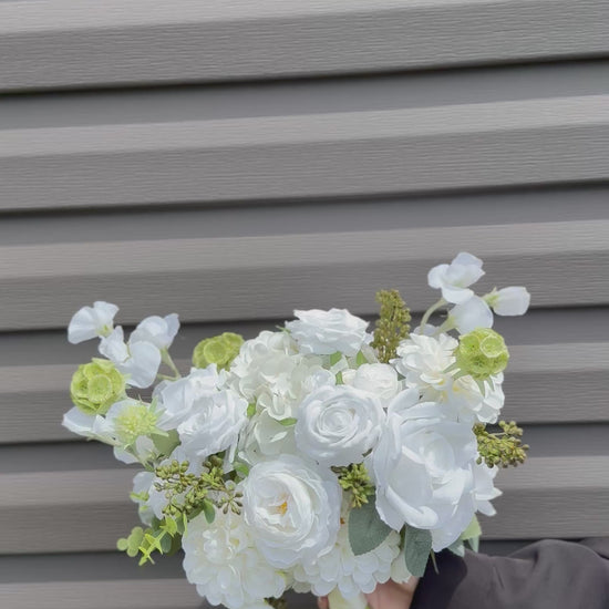 Classic modern faux white bridal bouquet with roses, dahlias, hydrangeas, scabiosa balls and berries 